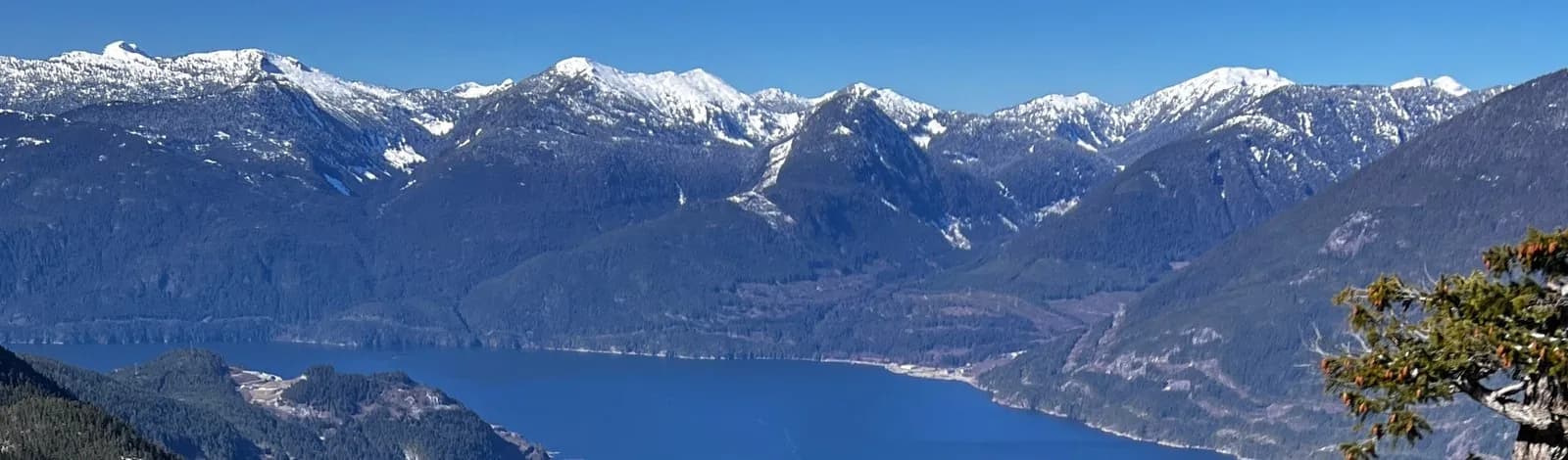 View from the top of the Sea to Sky Gondola over Howe Sound and the snow-capped mountains in Squamish
