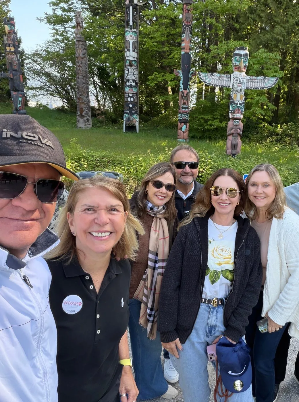 Local guide and group of clients smiling during a city tour in Vancouver