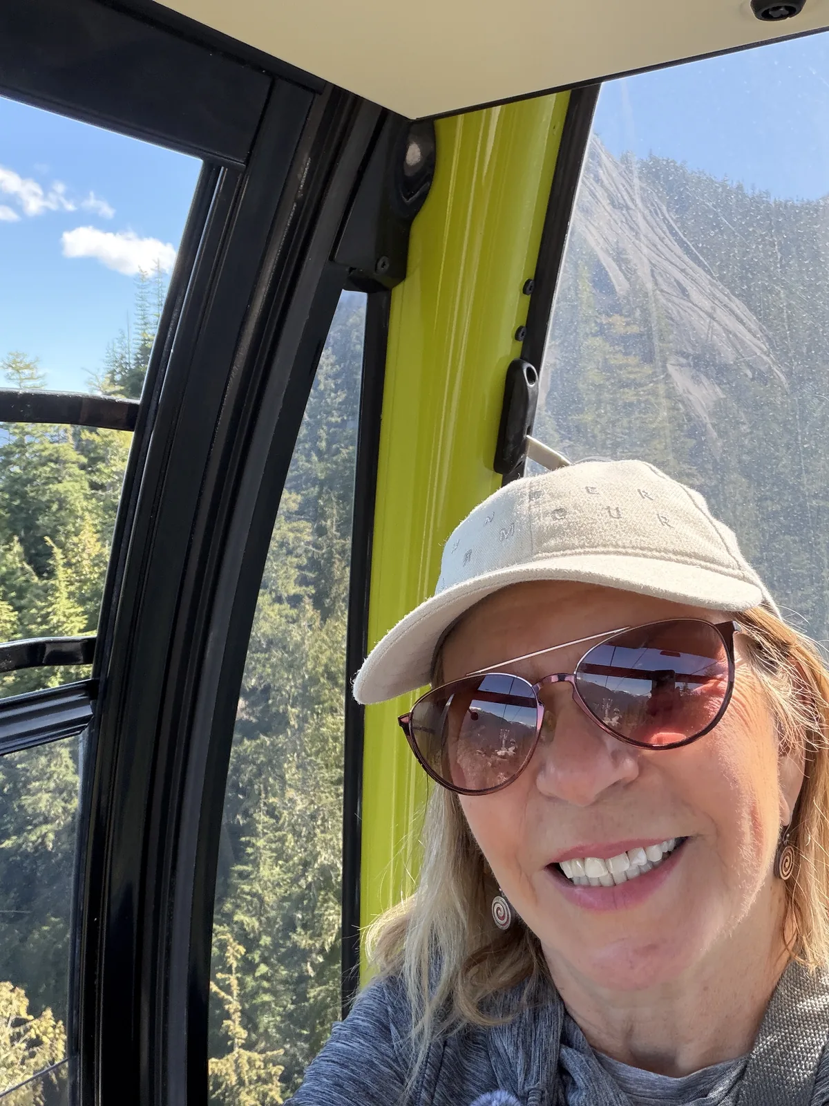 Sea to Sky Gondola cabin rising over the forest in Squamish